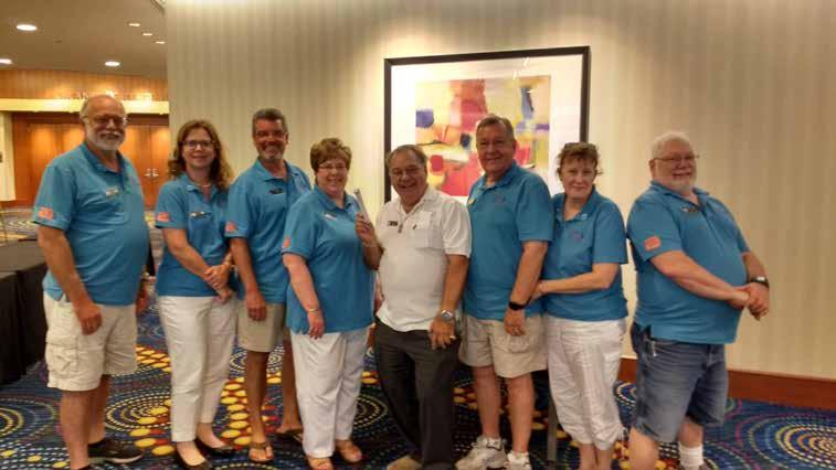Page 19 Raffle winners Janet Leh (right) and Ralph Ziegler (above center) along with volunteers at the 2018 Governing Board Meeting in Minneapolis.