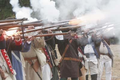 American revolutionary troop re-enactors fire on the Clearwater that is carrying