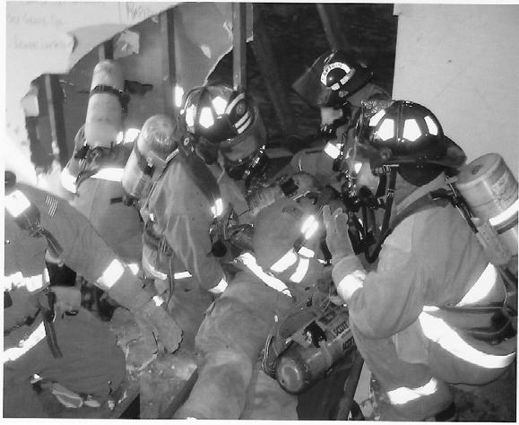 RIT Rescue works to move the downed firefighter through