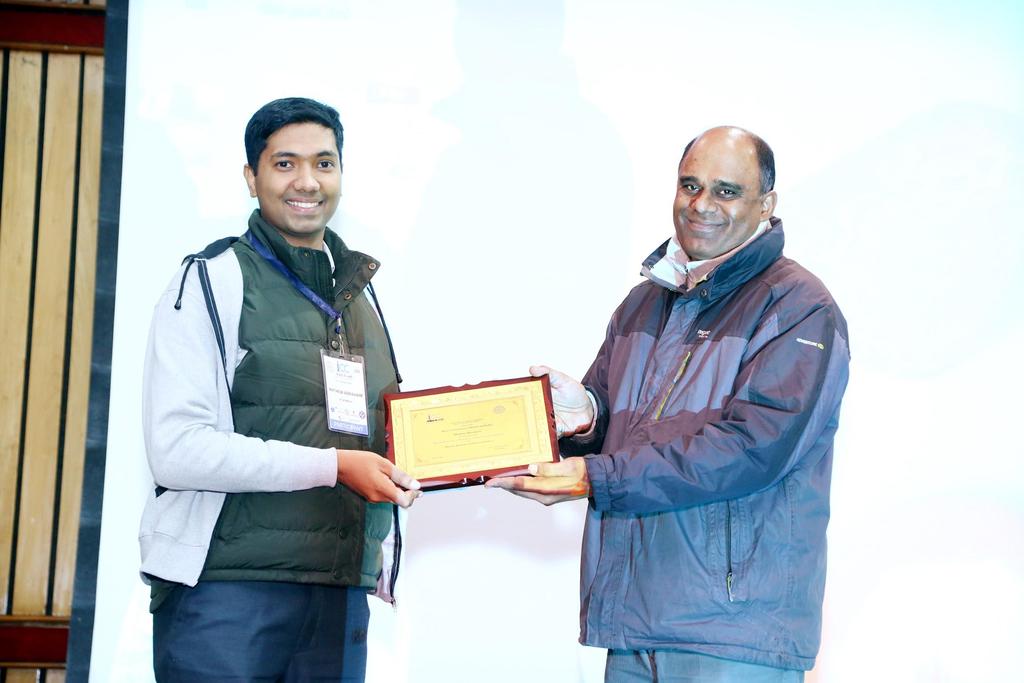 Figure 5: Presentations in regular sessions Figure 6: Mathew Abraham receiving the Best Student Paper Award from the Program Chair of ICC 2018, Dr.