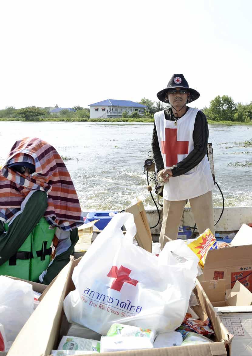 A Thai Red Cross medical team on its way to visit communities isolated by the flood waters.