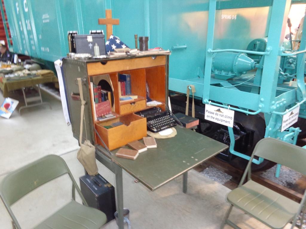 The Chaplain s field desk below contains