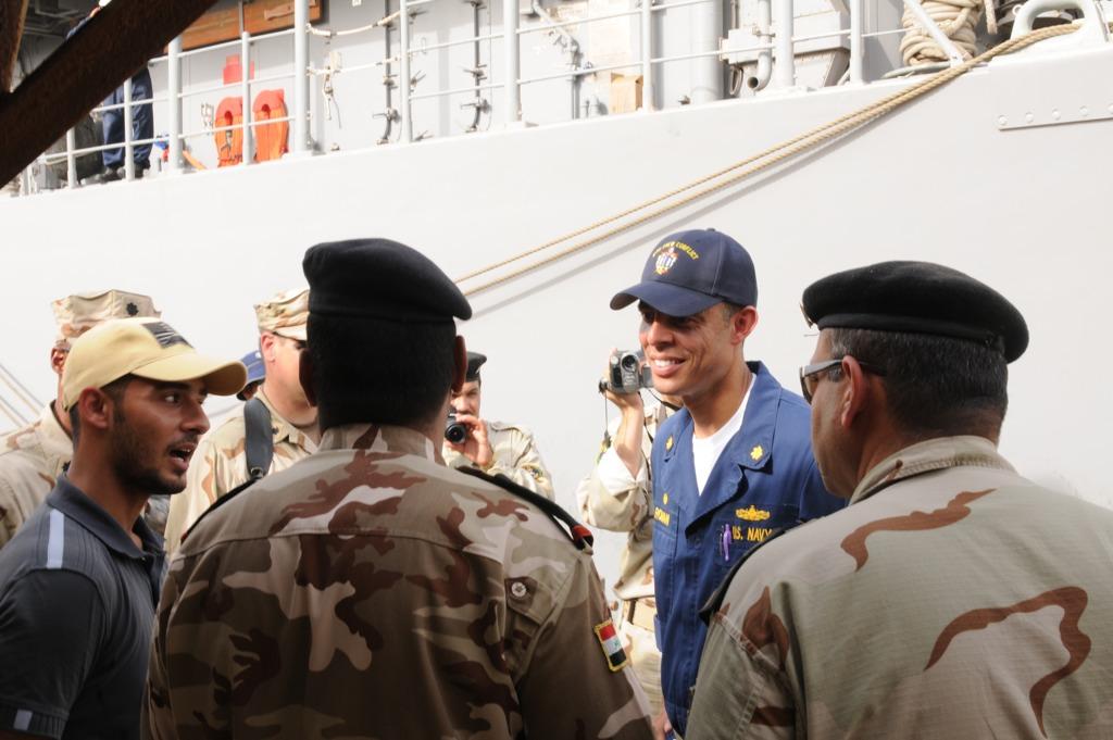U.S Navy Lt. Cmdr. Jose Roman assigned to USS Ardent Mine Countermeasure MCM-12 speaks with Iraqi Officials in Umm Qasr, Iraq Naval Base, Iraq, July 21, 2010.