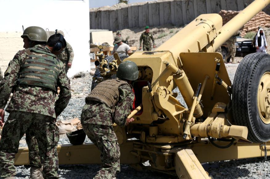 Afghan National Army soldiers, 2nd Kandak, 201st Corps, load live rounds into a D30 Howitzer for the live fire exercise on Forward Operating Base Metharlam, Laghnam province, Afghanistan,