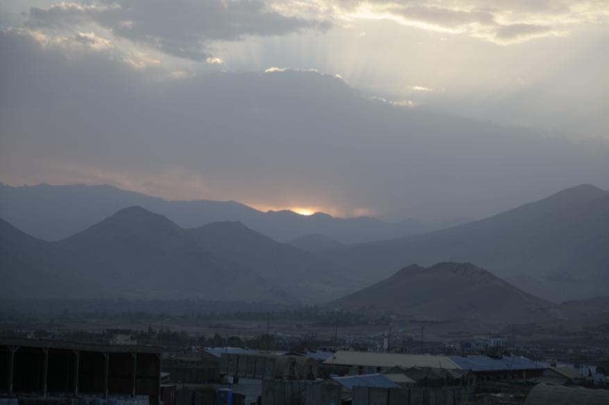 The sun sets over the mountains which could be seen from Forward Operating Base Airborne, located in