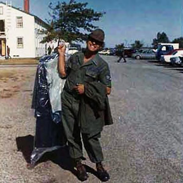 2_5 : Fairchild AFB, WA A1C Little Joe Studabaker swings heavy load of uniforms over shoulder, from base Laundry.