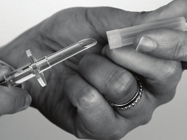 Replace the syringe cap, being careful not to touch the tip of the syringe with your hand.