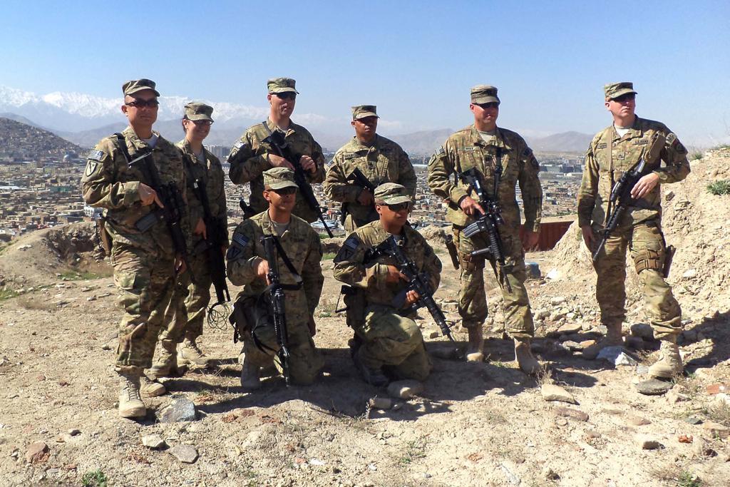 City, Afghanistan. Standing left to right, 1st Sgt. Joseph Prieto, Sgt.