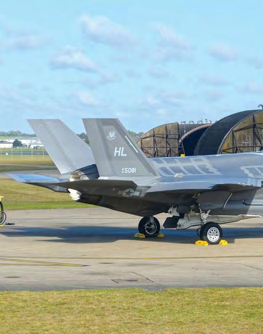 Below left to right: F-35A serial 13 5081 awaits its pilot for the mass mission on April 28. 90 Lt Col Jason Zumwalt, the 493rd FS commander, in his office.