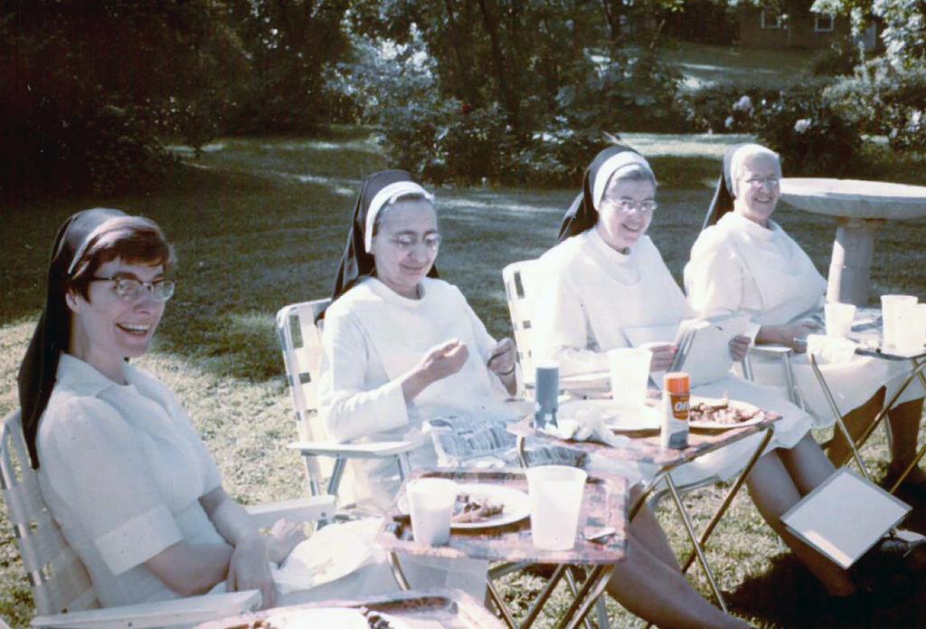 Enjoying an outdoor meal together are, from left, Sisters Elizabeth Becker, Francita Hattan,