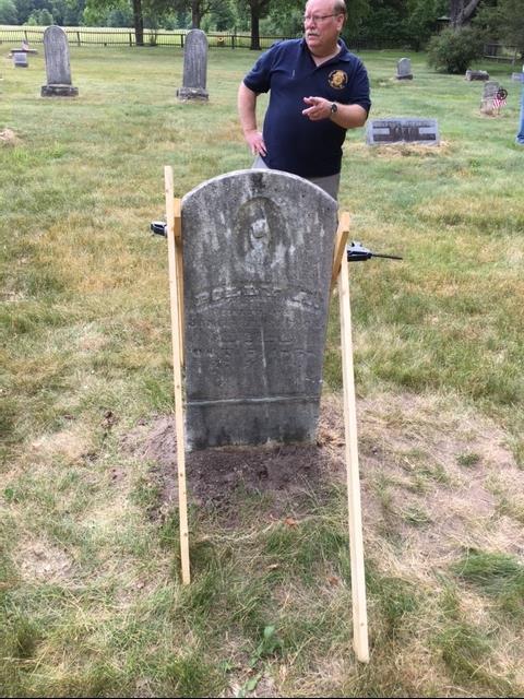 Repaired gravestone with bracing Grant, MI Dedication Several members of Camp 20 joined Austin