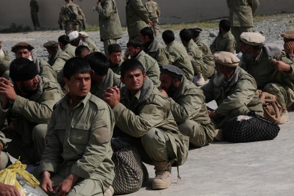 Afghan Local Police trainees wait to be air lifted to their new duty station on Forward Operating Base Bostic, Nuristan province, Afghanistan, April 18, 2013.