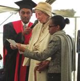 Graduates being given their degree and gifts from UK and Australian directors.