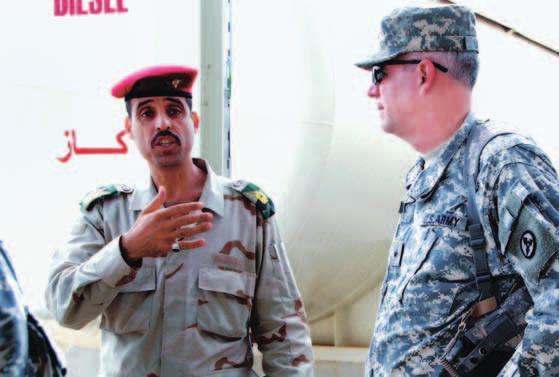 Iraqi MAJ Ahmed, the General Transportation Regiment (GTR) Training Officer, talks about fuel handler training classes with BG Michael J. Lally, Commander, 3rd Sustainment Command (Expeditionary).