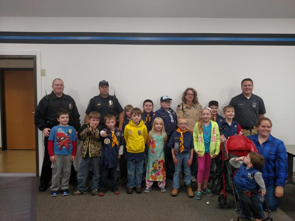 Deputy Marshal Michael, Sergeant Davis and Deputy Marshal Leggio stand for a picture with Cub Scout Pack