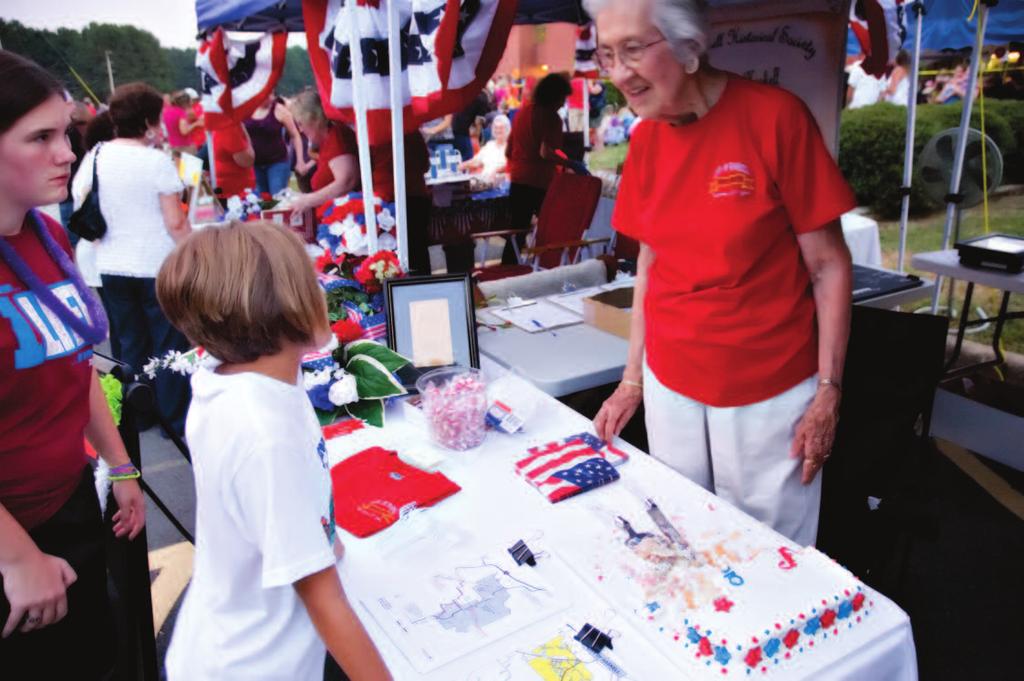 Haskell celebrates 100th birthday Haskell Alderman and League District 2 Vice President Rose Marie Wilkinson, above right, serves cake at the Haskell Historical Society s booth at the city s