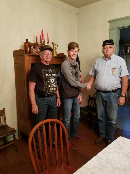 Here at a recent meeting of the William P. Benton Camp #28 showing Dennis Rigsby and Tom Ashley with his son Mathew Ashley, also a member of Benton Camp on his last meeting before departing for U.S.