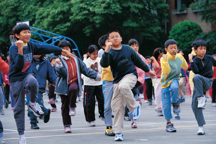Children gather in the playground for exercise after class.