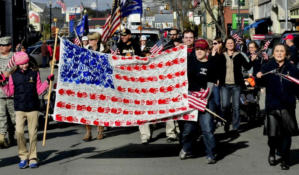 Handprint flag highlights Waterville Veterans Day parade The flag, made by students at St. John Regional Catholic School, had traveled to Maine National Guard troops in Afghanistan and back.