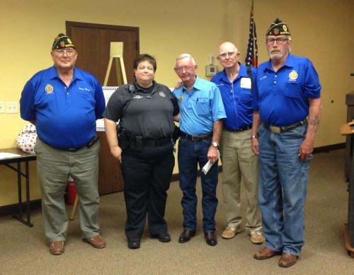 FUNDRAISER FOR OFFICER KRISTI TEW During Monday night s city commission meeting, American Legion Post 3 representative Wally Edwards presented Officer Kristi Tew with a check
