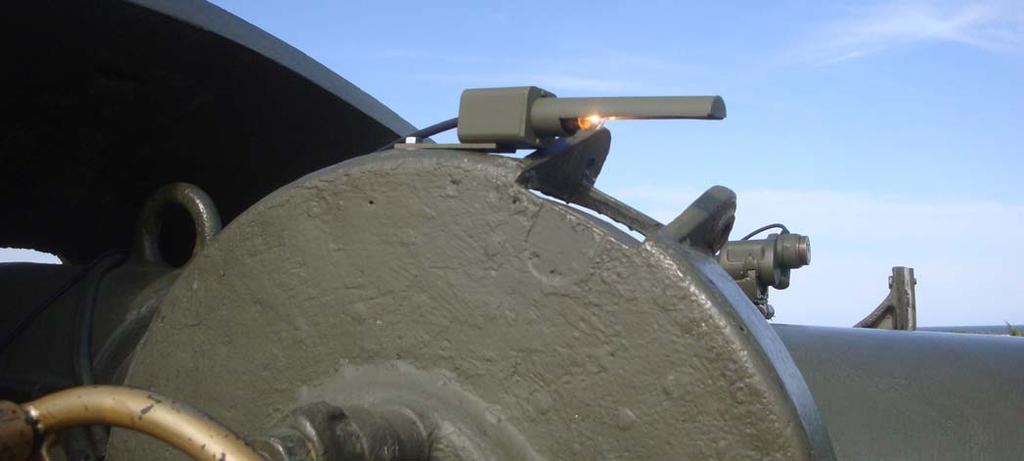 The silver colored device is shown below, installed on the breech, connected to the firing circuit.