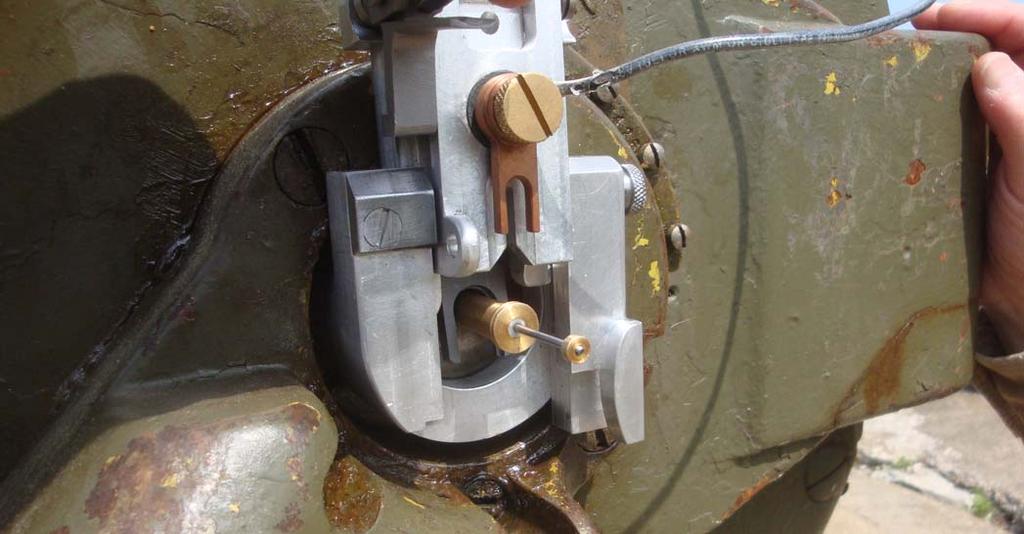 The device below is shown open, with the primer partially extracted.