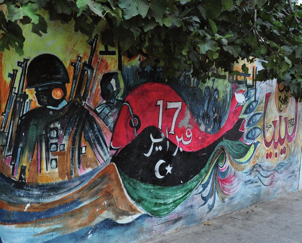 UNIVERSIT Y OF AMSTERDAM On the cover: mural in Tripoli, September 2013. The graffiti reads 17 February, and Libya free.