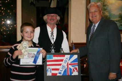 The Kentucky Pioneer, Volume 11, Issue 7 Page 3 George Mason Chapter Mark Humphries (in the Colonial outfit) and Chapter President David Cartmell congratulates the winner and runner-up in the chapter