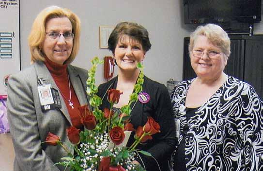 Congratulating Delois are Betsy Kullman, Executive Vice President/Chief Nursing Officer (left), and Mary
