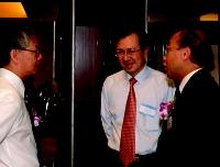 Miroslav Begovic from the USA, and Dr. Malcolm Kennedy from the UK. Conference delegates made to dance with Malay dancers at the Conference Banquet, Nov 27, 2003. NTU President Dr.