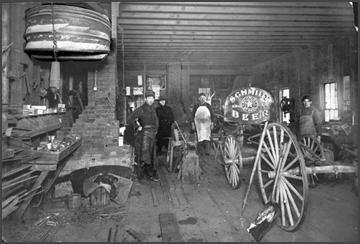 Frank Skok s Wagon Blacksmith and Horse Shoeing Shop, Interior Photo details: In the foreground, the bellows pumped oxygen into the coals for a white hot heat in its brick forge.