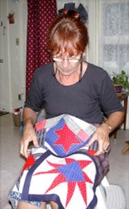 Local quilters assisting with memorial quilt By KW Hillis Feature Writer (Photo by KW Hillis) Beryl McMaster looks over the quilt blocks she is donating to a worldwide effort to memorialize the Sept.