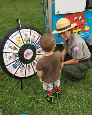 YANKEE ENGINEER December 2018 5 Park Ranger Karen Tyron talks water safety with kids by having them spin the prize wheel.