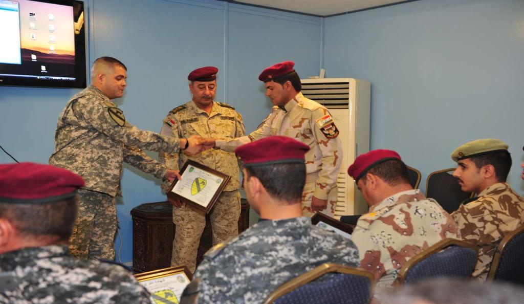 U.S. Soldiers with 399th Tactical Military Information Support Company,17th Psychological Operations Battalion, attached to 4th Brigade Combat Team, 1st Cavalry Division have lunch with Iraqi