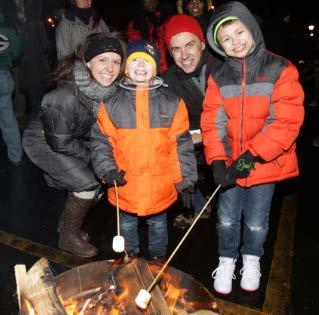 ESTABLISHING A NEW TRADITION Programming included: free chili & hot chocolate, winter cap and hand warmer giveaway, s'more roasting, performances by band and cheer,