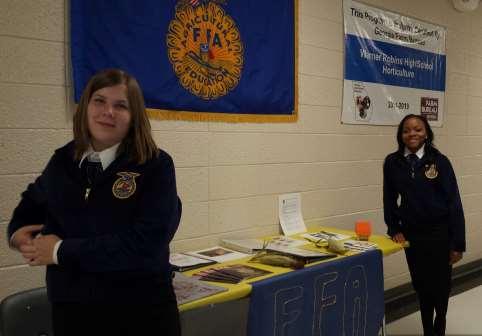 Page 4 WRHS FFA Welcomes Students Warner Robins High School FFA members, Johuna Granville and Laurie Hall, helped out with the school s open house on August 18, 2014.