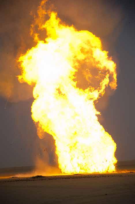 Several thousand pounds of Kuwaiti propellant burn across the desert