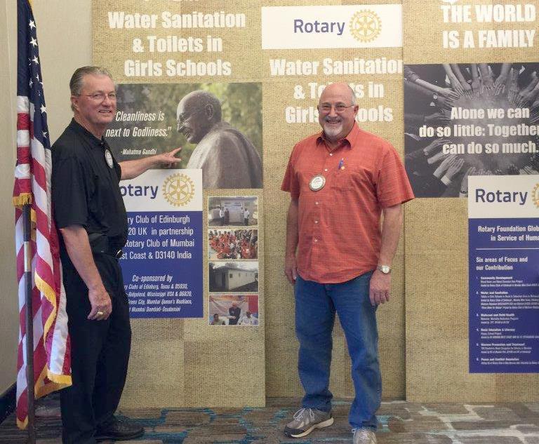 Madison-Ridgeland Rotary Club members Jim Jeter and Glenn Helman stand with the display that was exhibited in Atlanta for the Rotary
