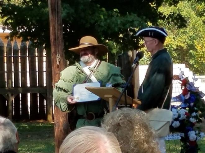 The Compatriot must have participated in at least fifteen (15) grave marking events. Compatriot James Stone is presented the Von Steuben Medal by President Eagan at the Gathering at Sycamore Shoals.