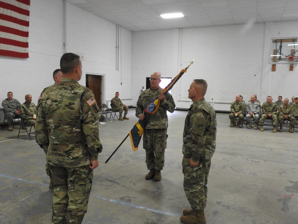 Photo #1 COL Hallenbeck receives Camp Grayling colors from Assistant Adjutant General Installations, MG Michael Stone during Camp Grayling Joint Maneuver Training Center s Change