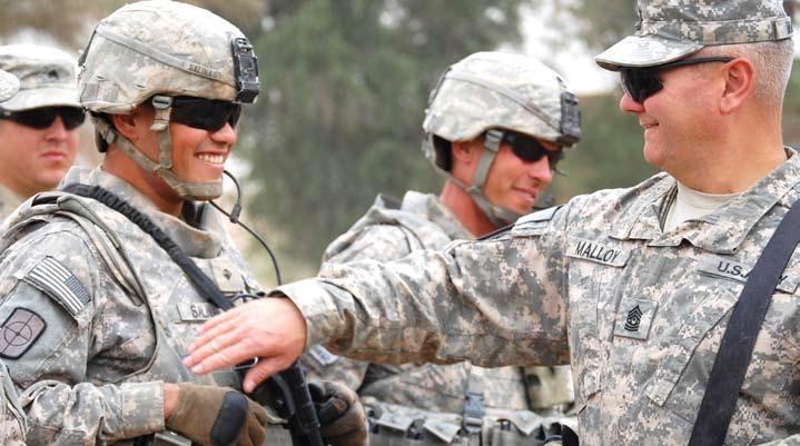 Tomas Chavez (left), 277th Engineer Company, 101st Engineer Battalion, of New Braunfels, Texas, shakes hands with 1st Cavalry Division s
