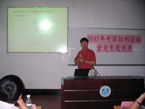 Fig.8: Professor Zongli Lin presents a pre-conference workshop on the analysis and design of control systems with actuator saturation at the 24 th CCC, 2005.