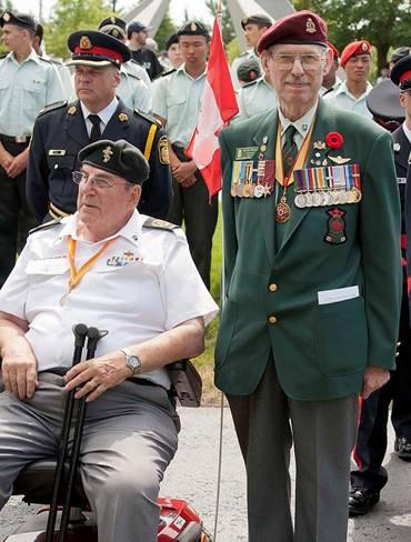 Davidson, seated on electric scooter, is a former national president of the Korea Veterans Association of Canada, president of the Royal Canadian Legion in Kitchener, Ontario