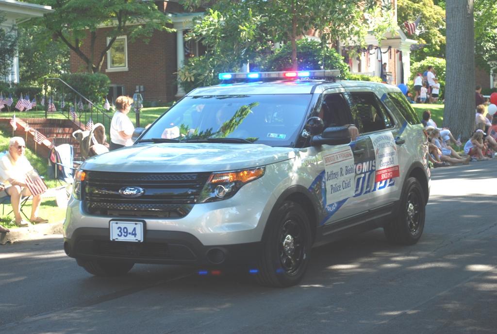 The lead police vehicle driven by Police Chief Jeffrey R. Biehl. (Pictured L-R) The former police officers, 1 st Row: Sergeant Daniel P.
