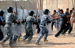 Instructed by Iraqi police officers and mentored by the NATO Training Mission- Iraq Carabinieri, Italy s paramilitary training unit, the federal police trainees learn methods of crowd and riot