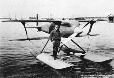 Jimmie and the Curtiss Navy racer Jimmie Doolittle with the Shell Oil Company's "400." a Travel Air Model R.