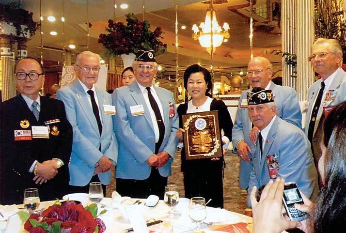 Following that, she gave special gifts to each Korean War veteran, which included two traditional jugs of rice wine and a wooden spoon and chop sticks set.