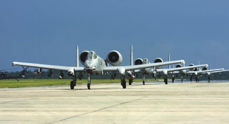 2 A four-ship of A-10Cs of the 7th Fighter Squadron line up for takeoff.