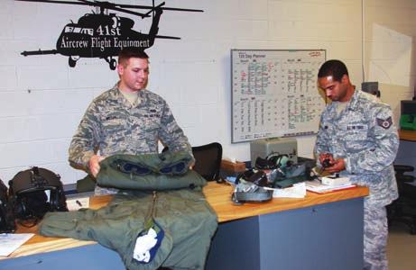 Randy Jones of the 1st Aircrew Flight Equipment Unit preflight gear for an HH-60 crew,