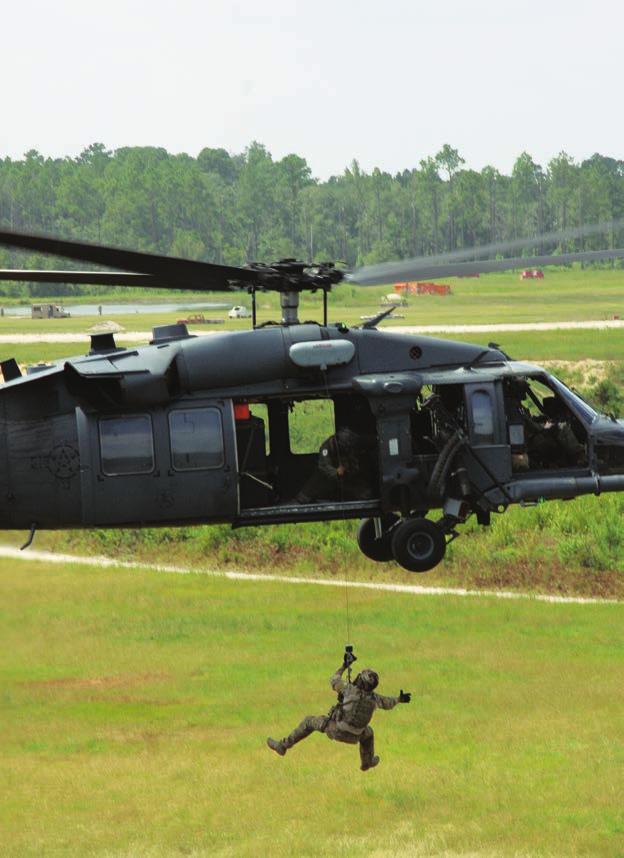 1 2 1 A pararescueman is hoisted by a 1st Rescue Squadron HH- 60G Pave Hawk on the Grand Bay complex.